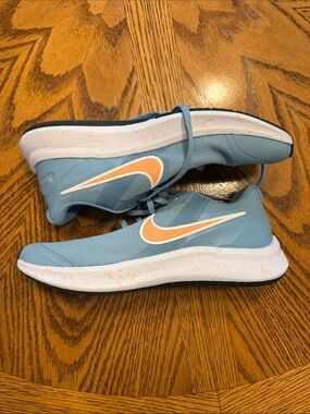 Nike Light Blue Running Shoes with Peach Swoosh